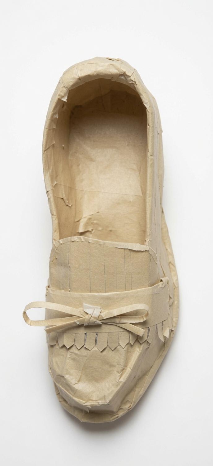 Front and top view of a masking-tape ballet flat