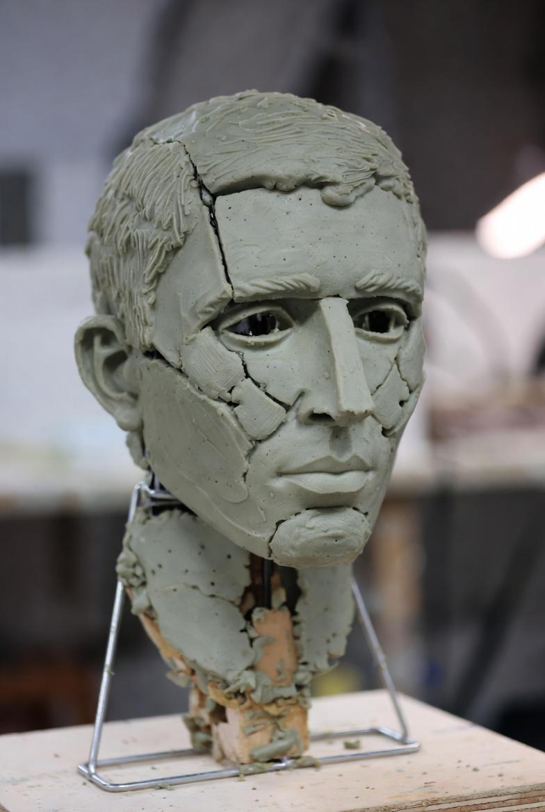 Green portrait bust study on an armature